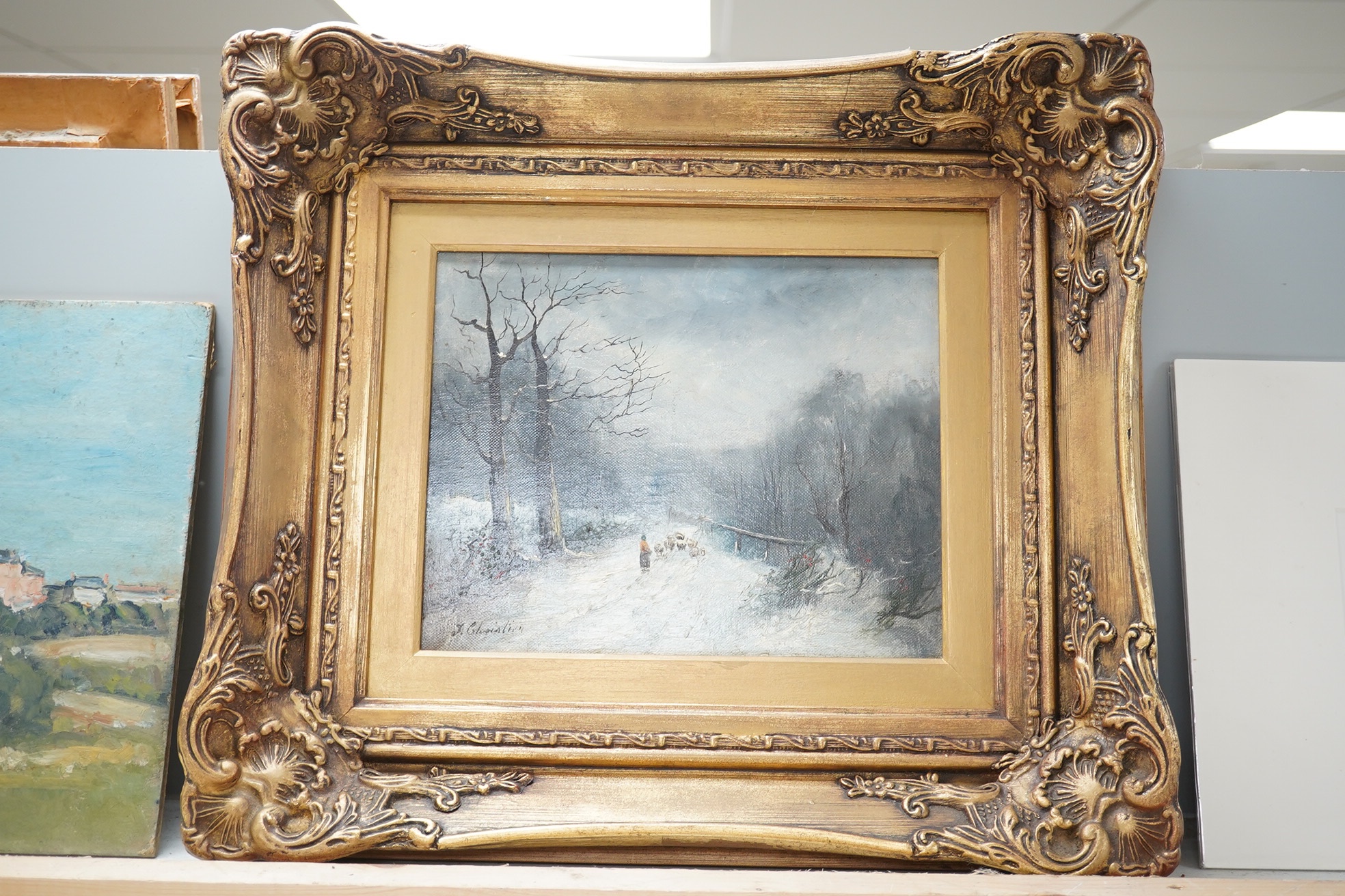 J Christian, oil on canvas, Winter landscape with figure and flock of sheep, signed, 20 x 24.5cm, ornate gilt framed. Condition - good